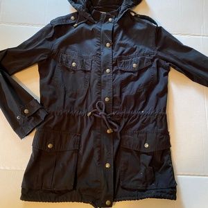 Black lightweight jacket with lots of snaps, pockets, epaulets